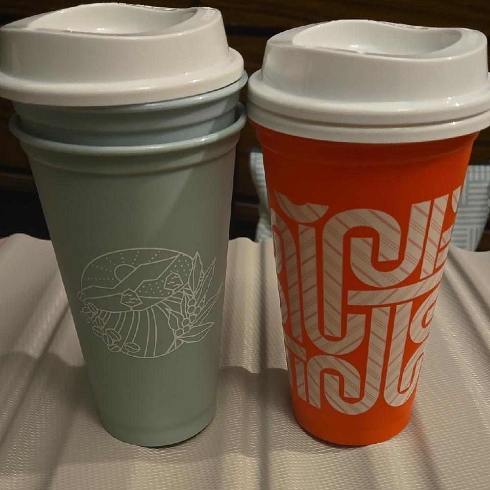 Twp Green  And One Orange Starbucks Cup